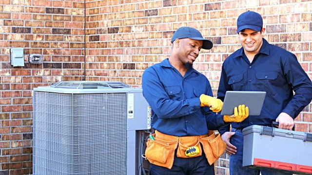 air conditioning repair men working